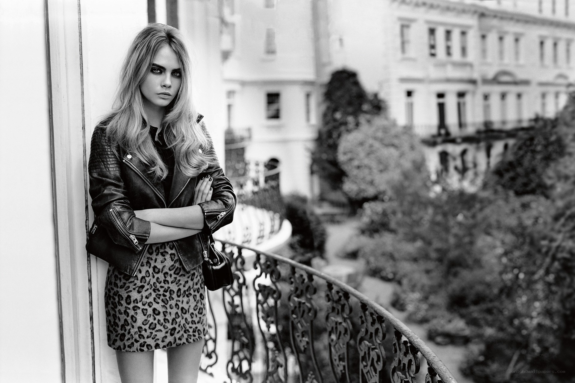 Cara Delevingne on a balcony