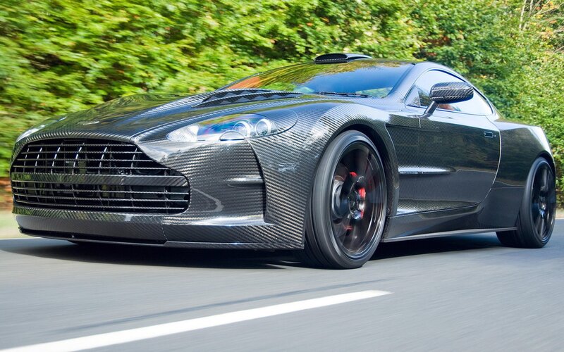 Carbon-fiber Sports Car — Black, Dynamic, Afternoon, Photograph, Road, Trees, Grille, Gray