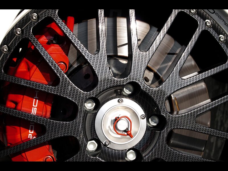 carbon fiber wheel with red brake caliper