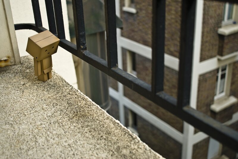 Cardboard Box Figure — Brown, Contemplative, Afternoon