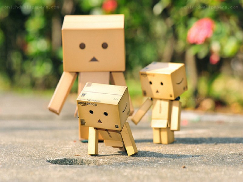 Cardboard box figures in garden