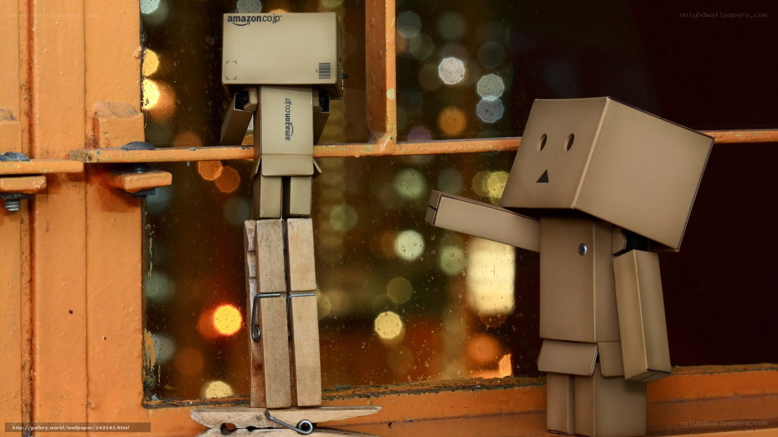 cardboard box figures on window