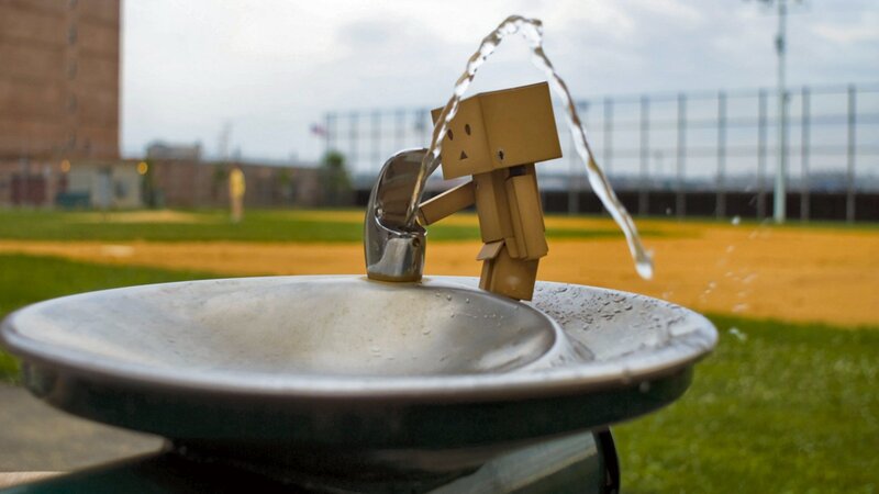 cardboard figure at water fountain