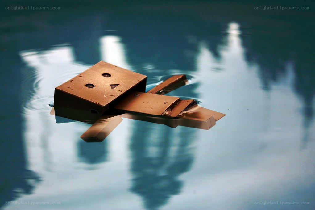 Cardboard figure floating in water