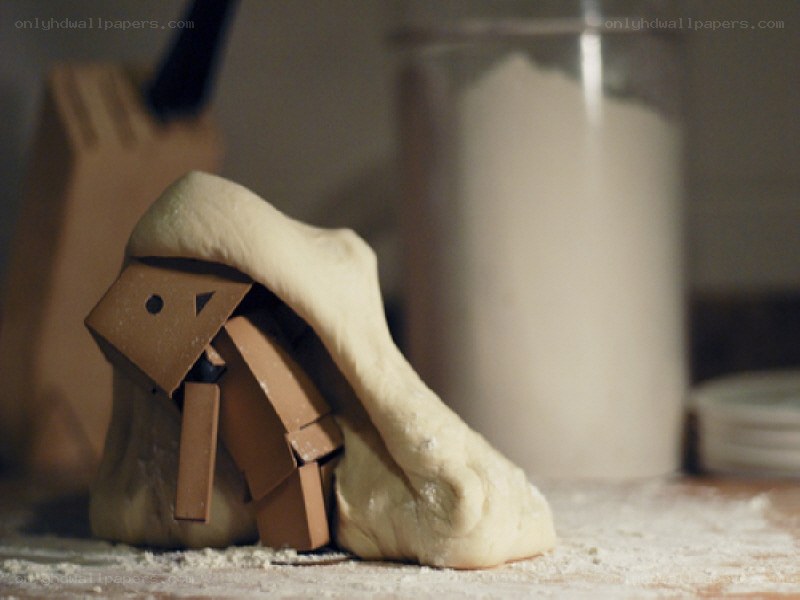 Cardboard figure under dough