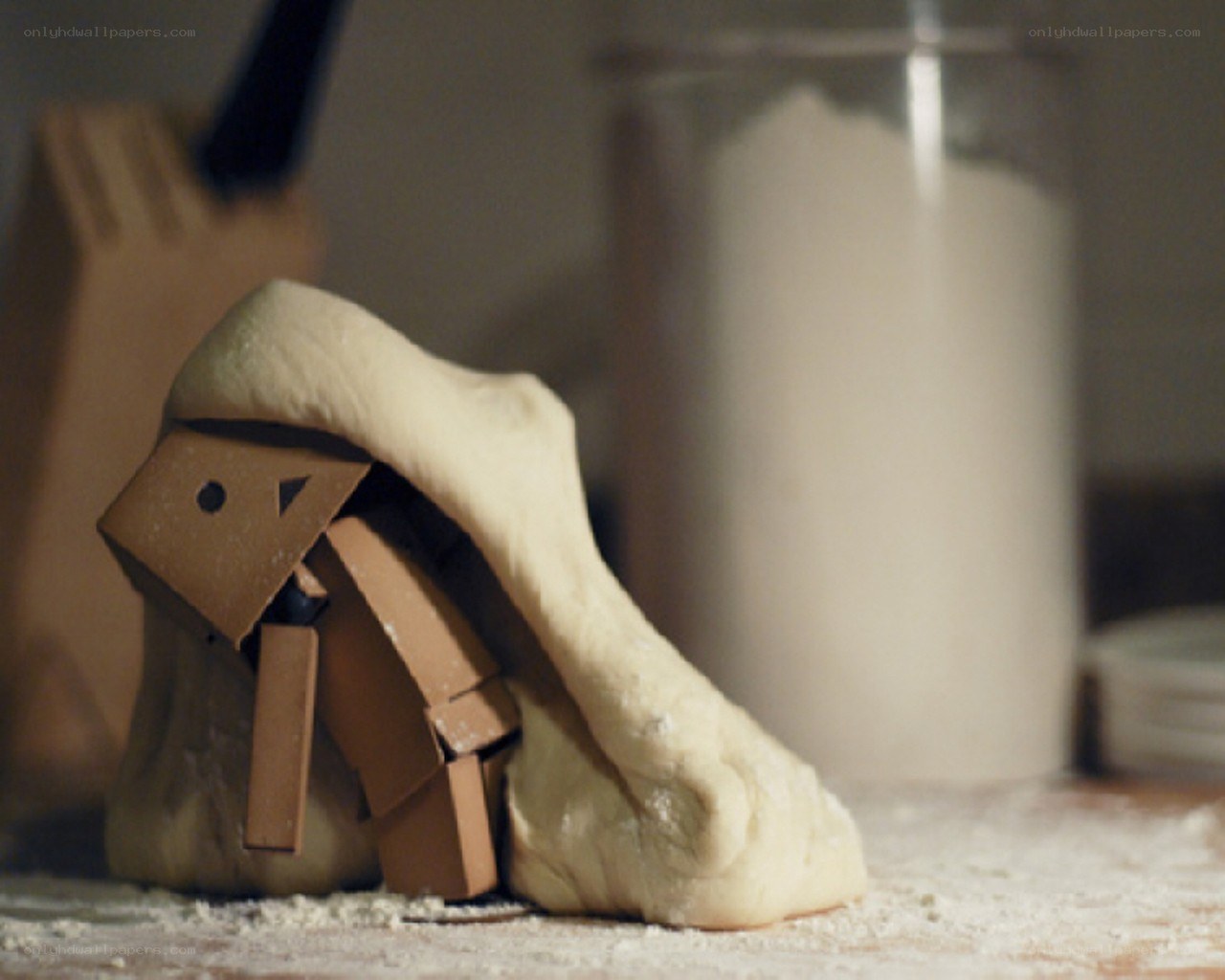Cardboard figure under dough
