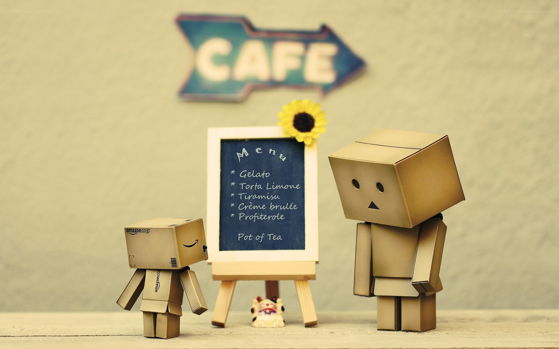 Cardboard figures at a cafe