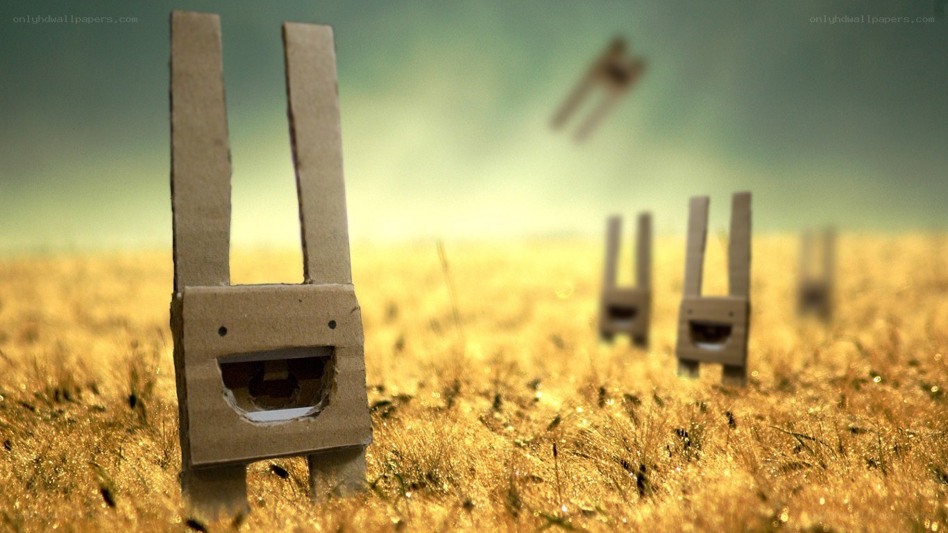 Cardboard rabbits in a field