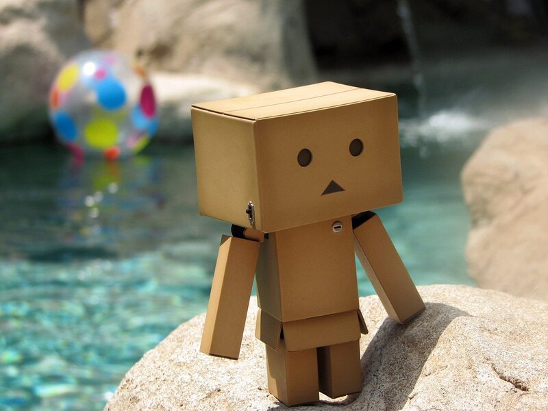 Cardboard robot by pool