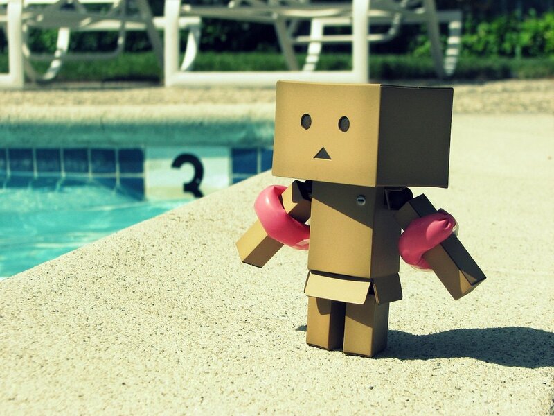 cardboard robot by pool