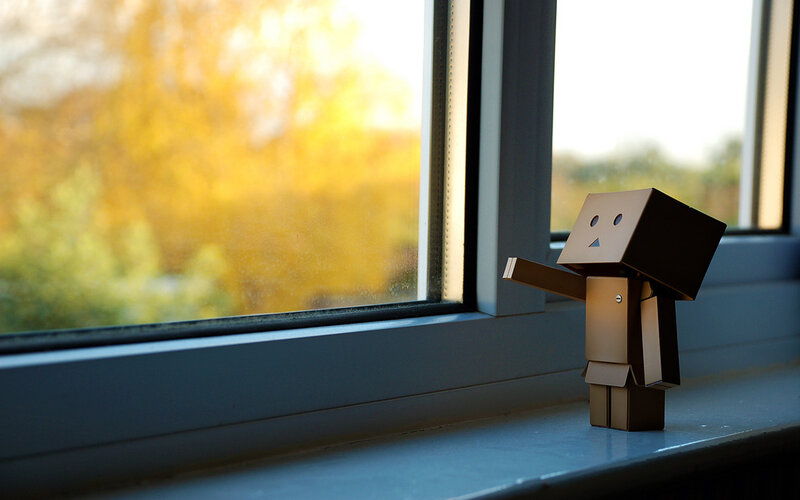 cardboard robot by window