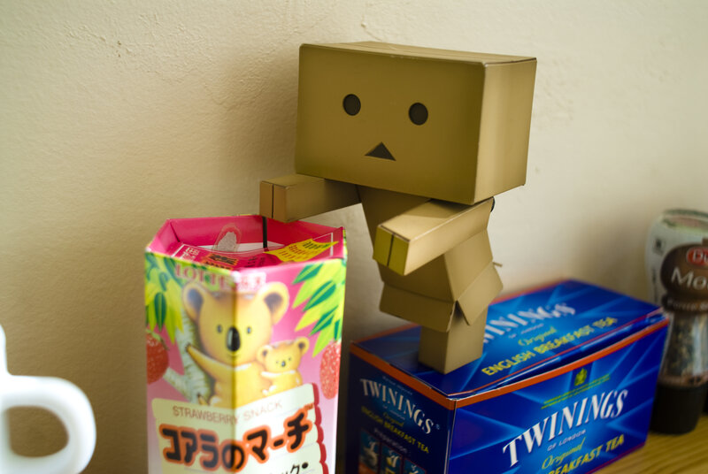 Cardboard Robot Figure — Brown, Calm, Photograph, Snack Box