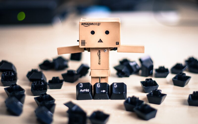 Cardboard Robot Figure — Brown, Playful, Photograph