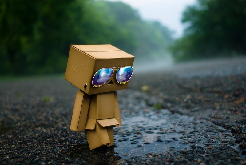Cardboard Robot Figure — Brown, Rainy
