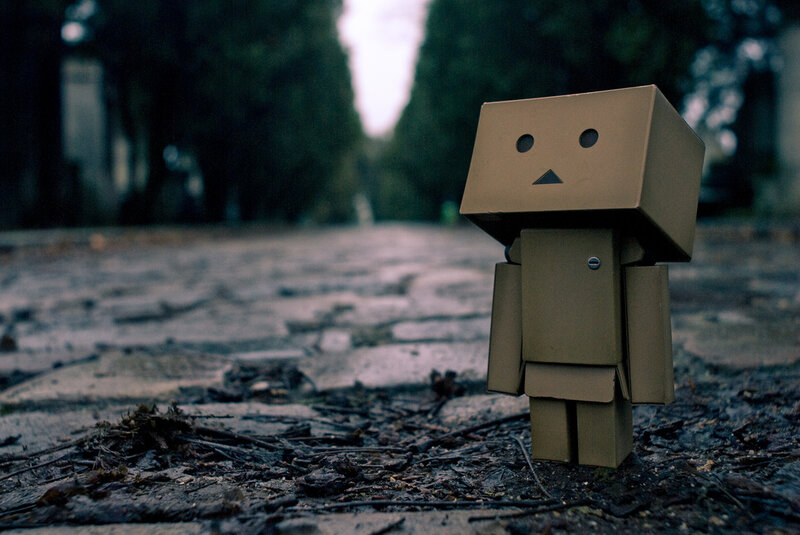 Cardboard Robot Figure — Brown, Somber, Photograph