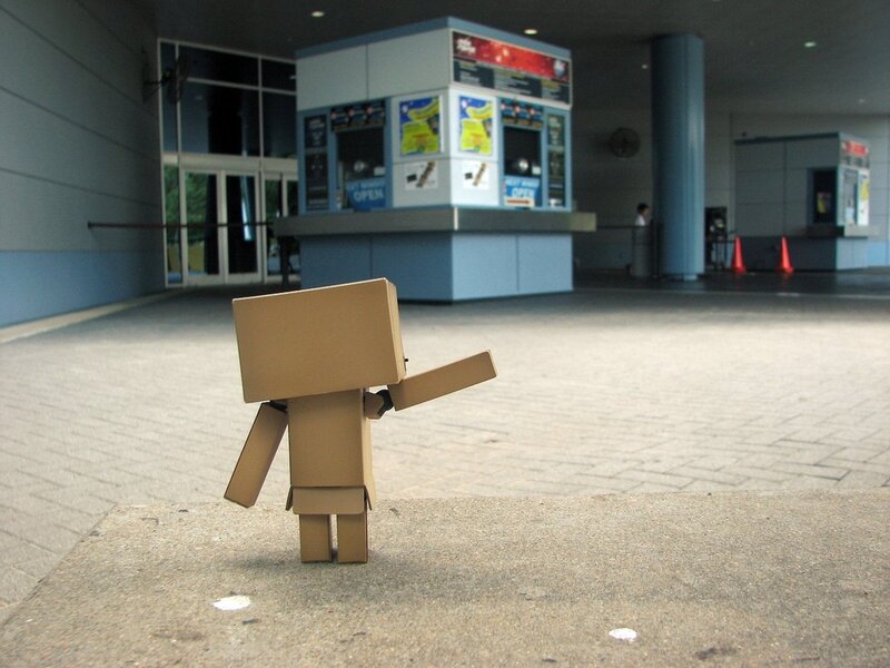 Cardboard robot in front of ticket booth