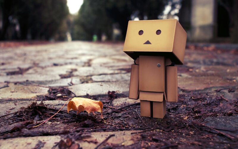 Cardboard robot on a path