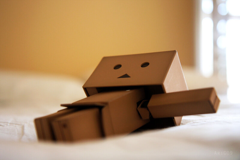 Cardboard robot on bed