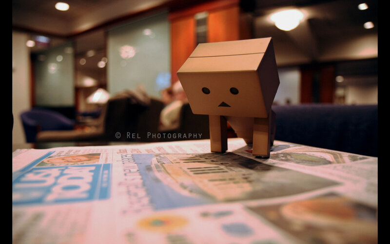 cardboard robot on newspaper