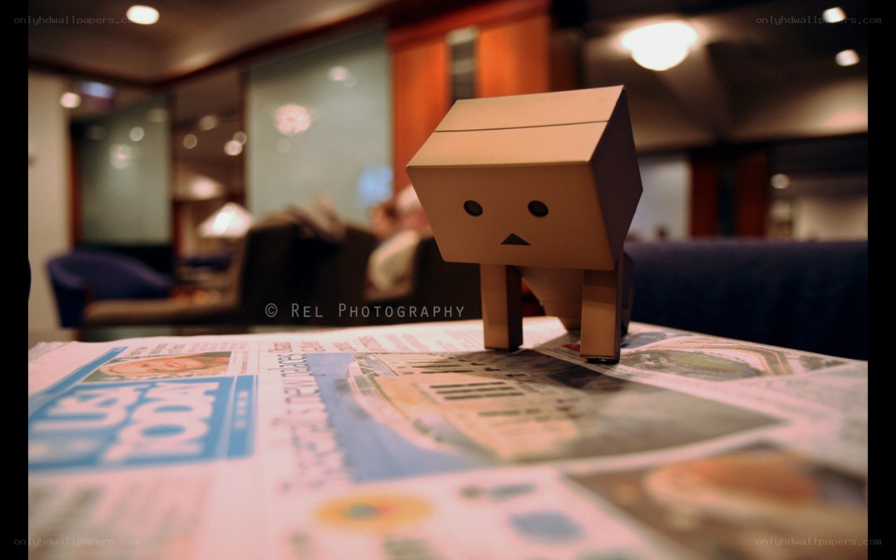 cardboard robot on newspaper
