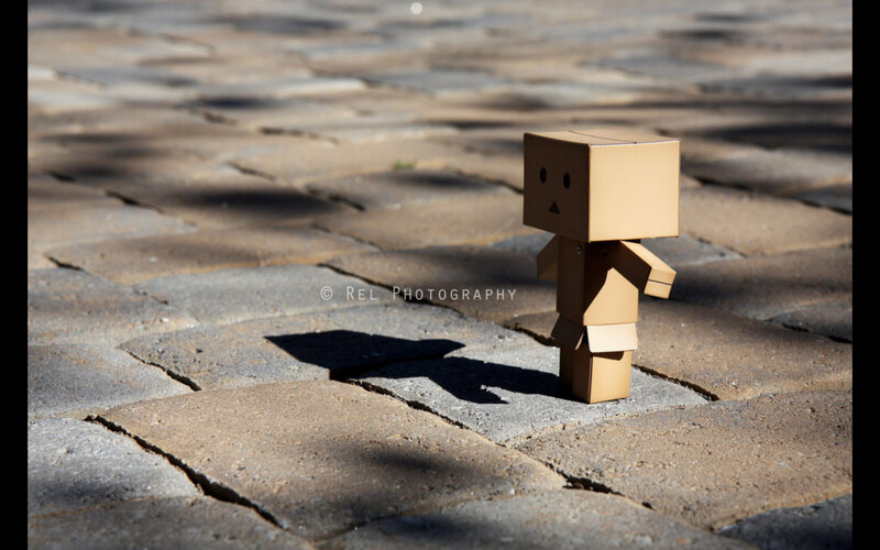 cardboard robot on pavement