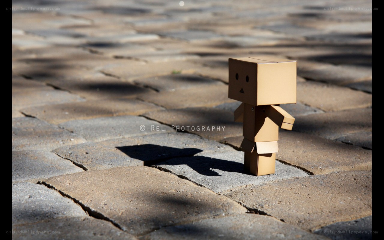 cardboard robot on pavement