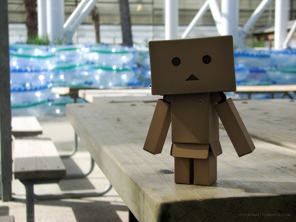 Cardboard robot on picnic table