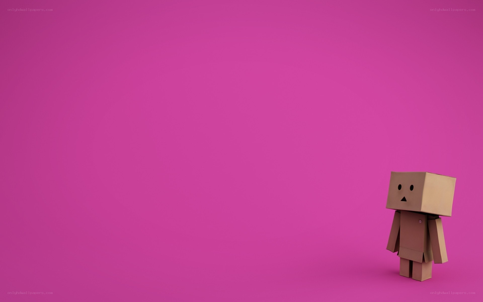 cardboard robot on pink