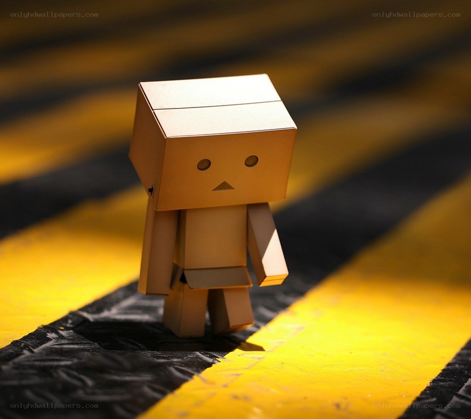cardboard robot on yellow stripes