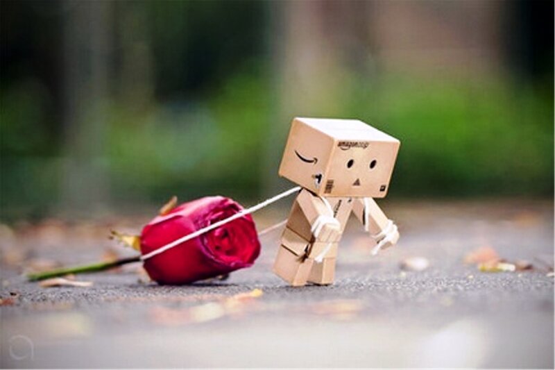 Cardboard Robot Pulling Rose