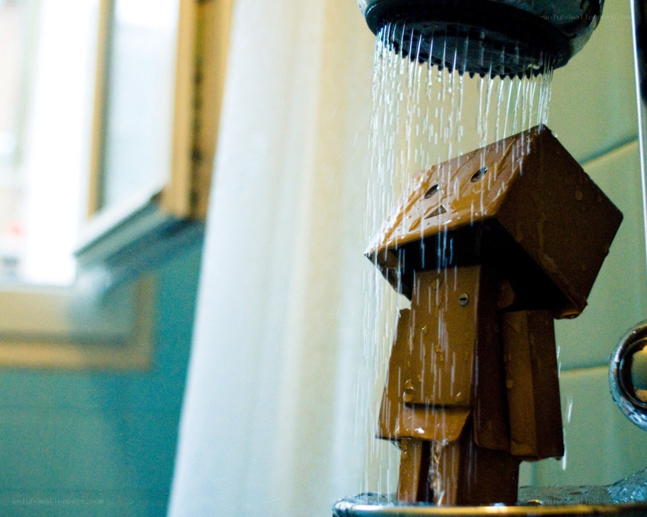 cardboard robot under shower