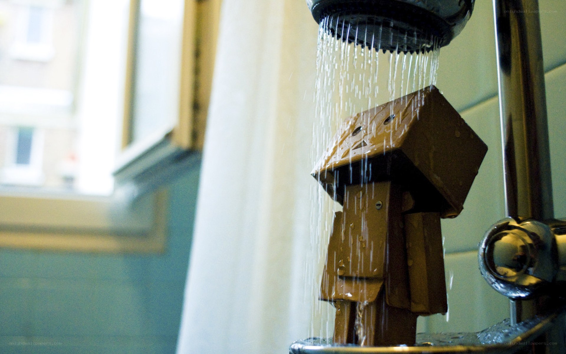 cardboard robot under shower