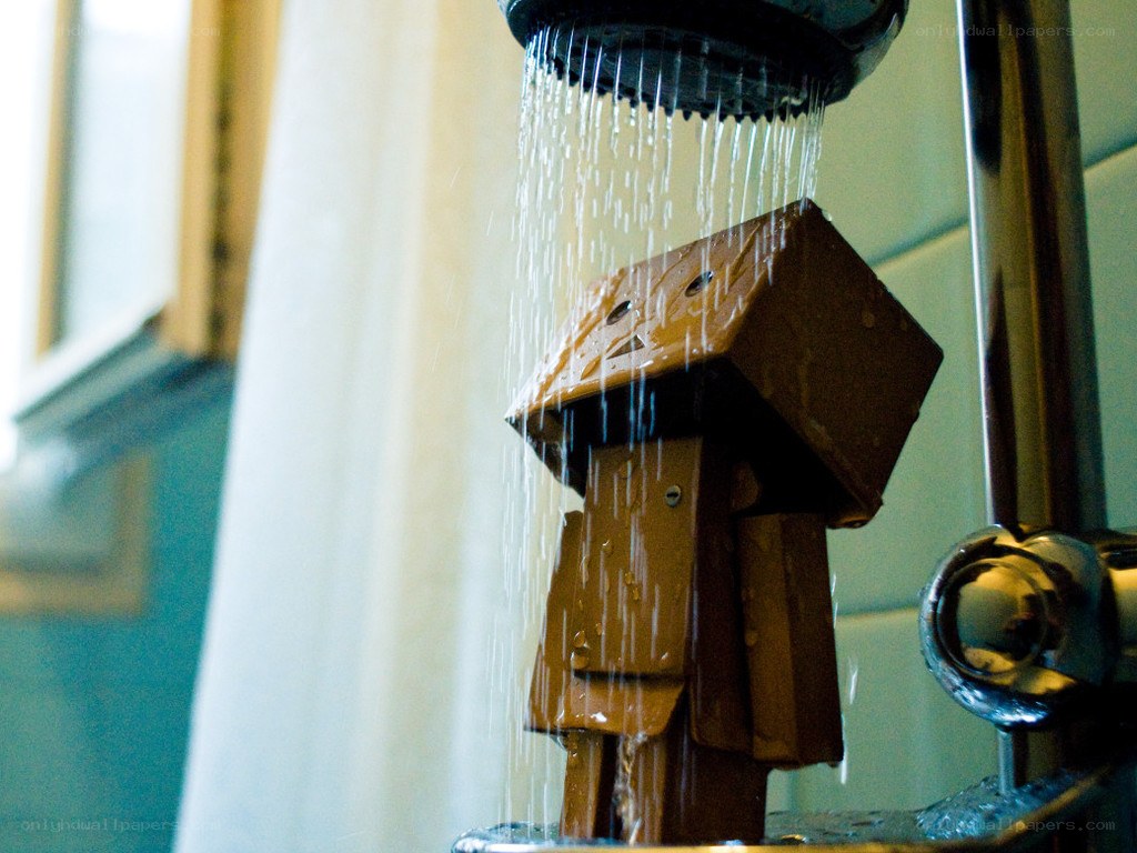 cardboard robot under shower