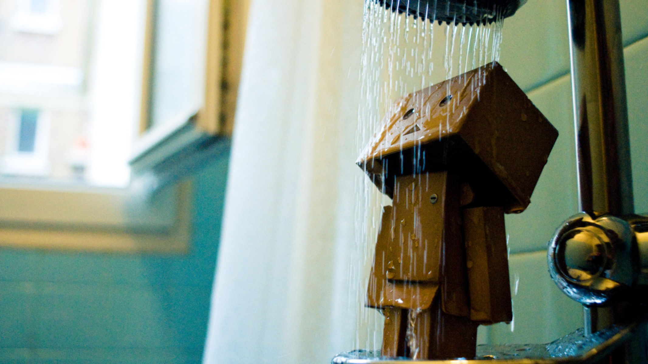 Cardboard robot under shower