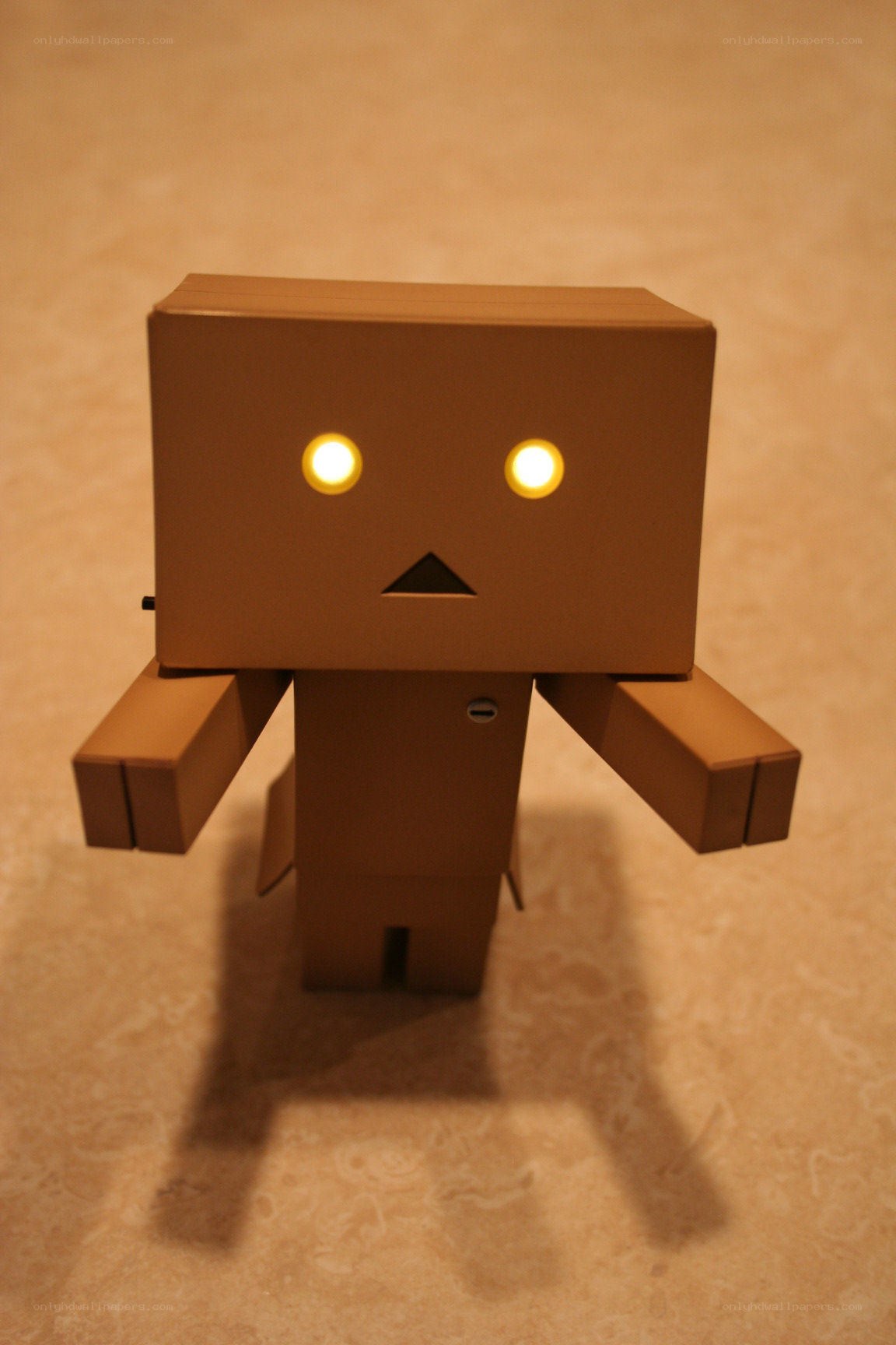 cardboard robot with glowing eyes