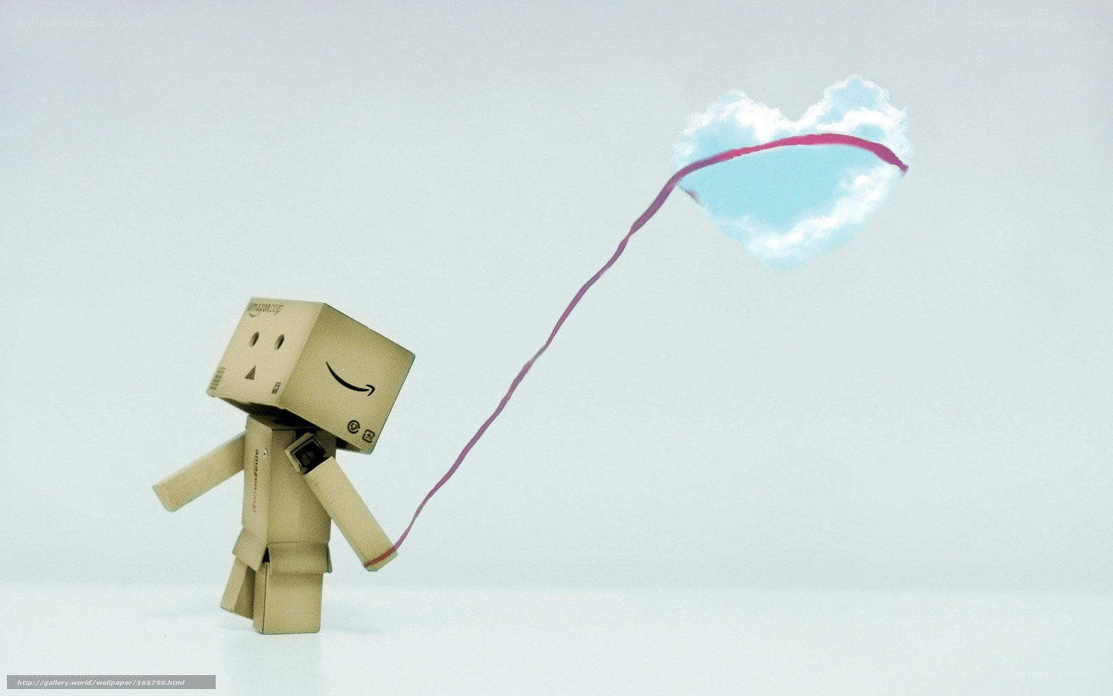 cardboard robot with heart balloon