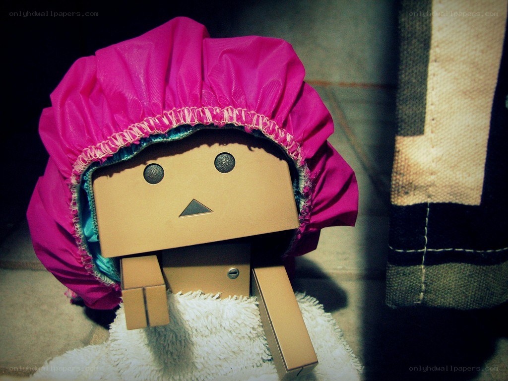 cardboard robot with pink bonnet