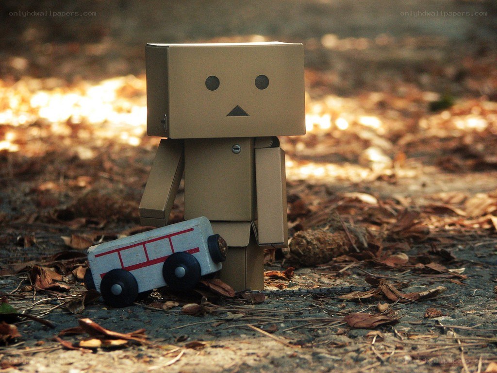 Cardboard robot with toy bus