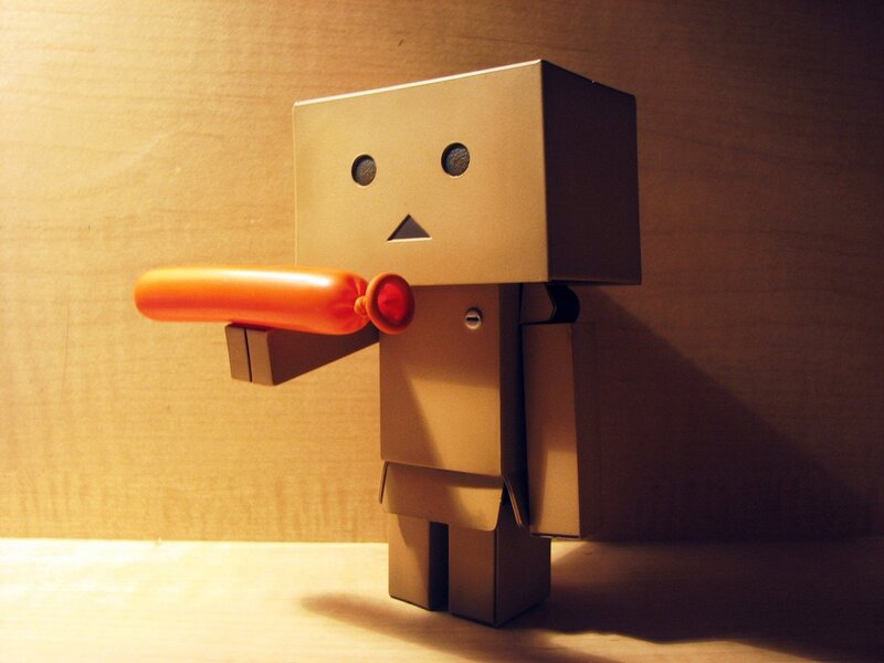 cardboard robot with toy gun