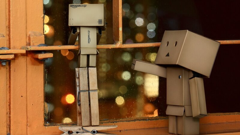 Cardboard robots by window