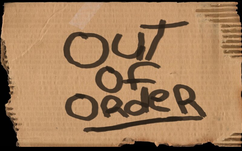 Cardboard sign reading 'Out of Order'
