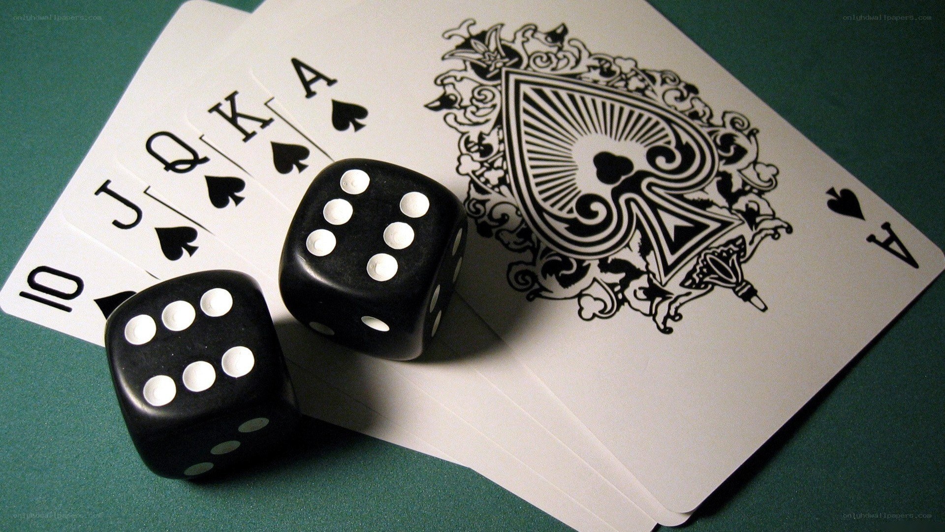 cards and dice on green felt