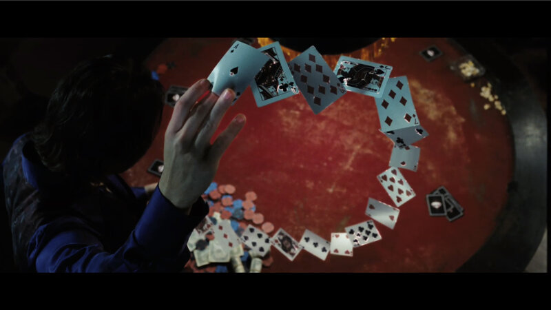 cards in mid-air at table