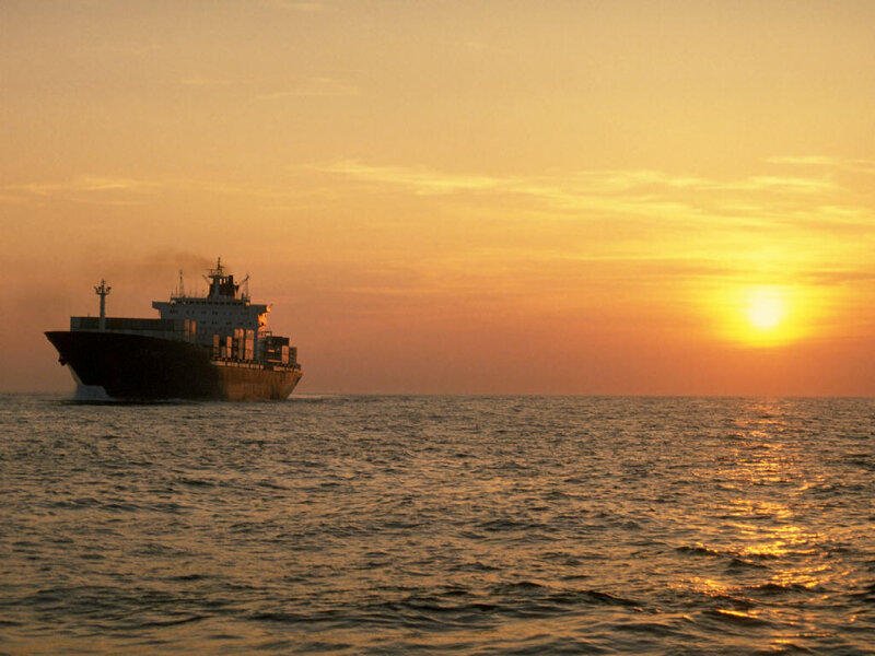 Cargo ship at sunset