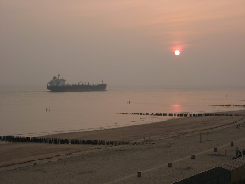 Cargo Ship at Sunset — Orange, Serene