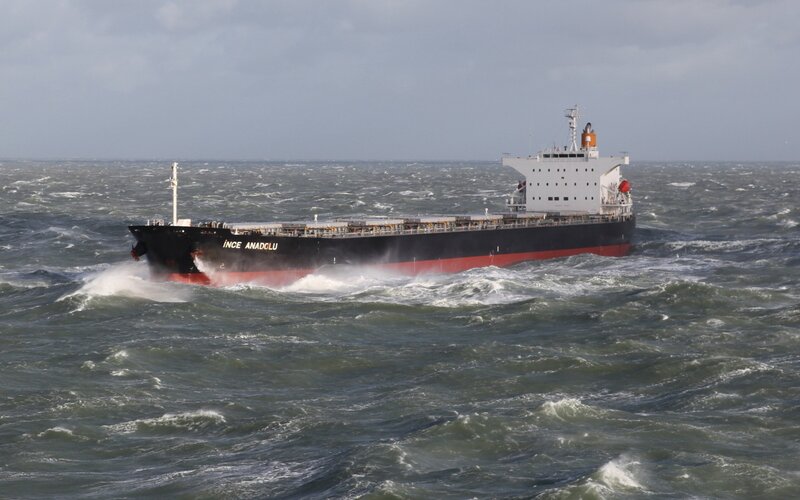 Cargo Ship in Rough Sea — Gray, Dramatic