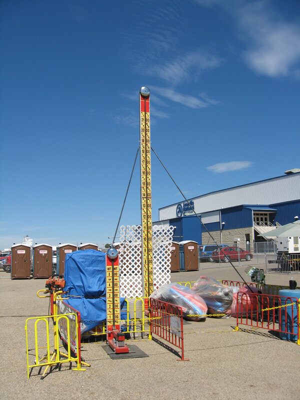 Carnival game with height measuring pole