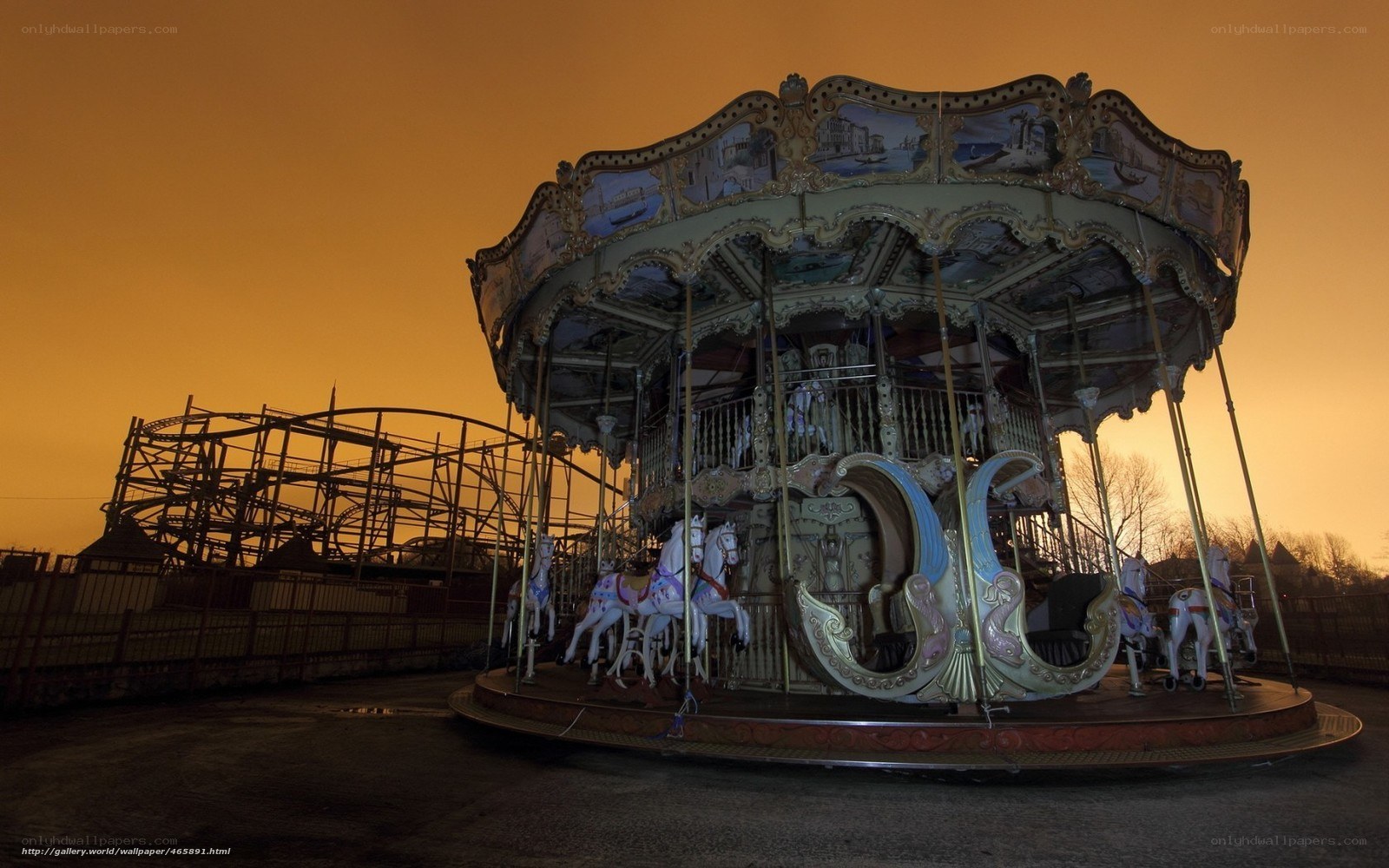 Carousel at dusk in amusement park