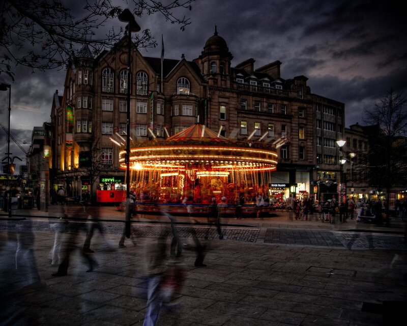 Carousel at dusk in city square