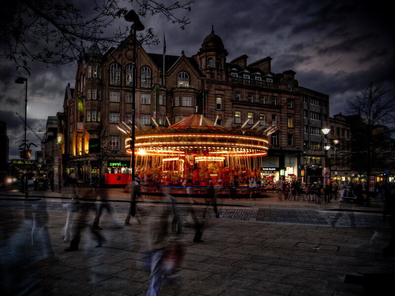 Carousel at dusk in city square
